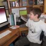 brainfood is the new age homeschooling -boy at his computer